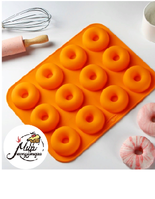 Фото Форма силиконовая для выпечки Доляна «Сладости.Пончик», 33×25×2 см, 12 ячеек, d=6,8 см, цвет МИКС
